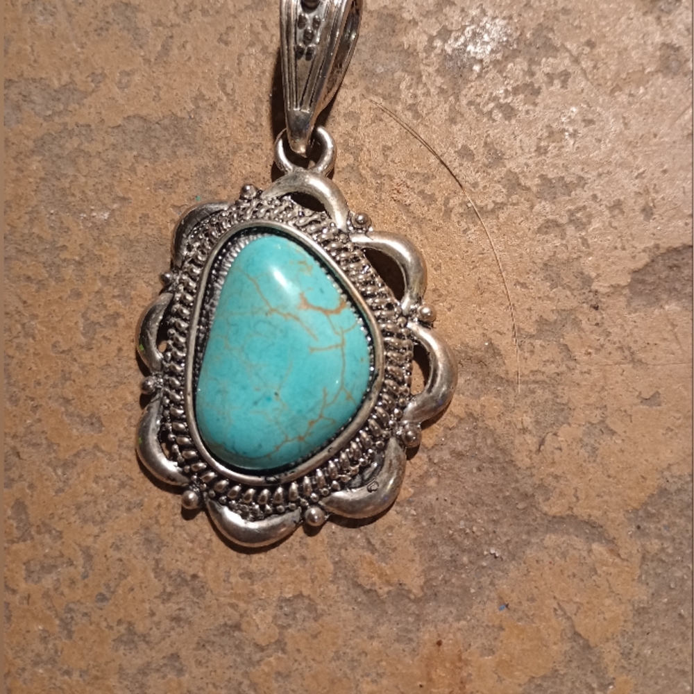 Turquoise and silver pendant